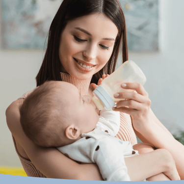 Parent bottle-feeding a baby