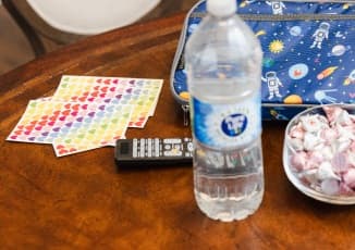 A table of heart scavenger hunt items with a bottle of Pure Life purified water.