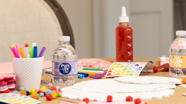 All the craft materials needed to create Do It Yourself Valentine's Day cards, including Pure Life purified water.