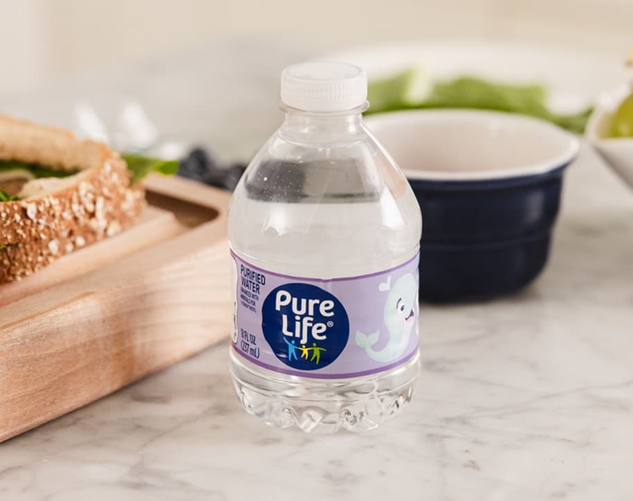 An 8 fluid ounce bottle of Pure Life purified water with a meal.